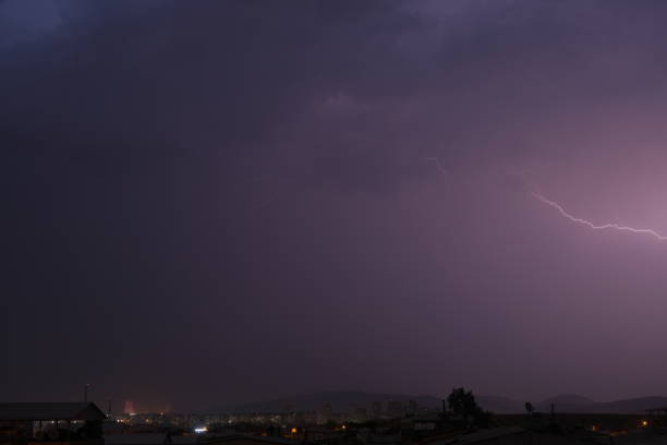 Multiple lightnings over bright blue sky in the night
