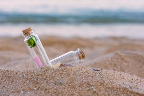 istock Message or letter in bottle on the tropical beach 1344419670
