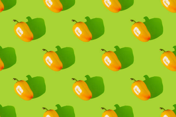 istock Bell pepper on a green background. Paprika seamless pattern 1344421924