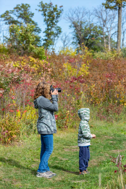 istock Girl Stopped to Take Photo During Hike 1344423520