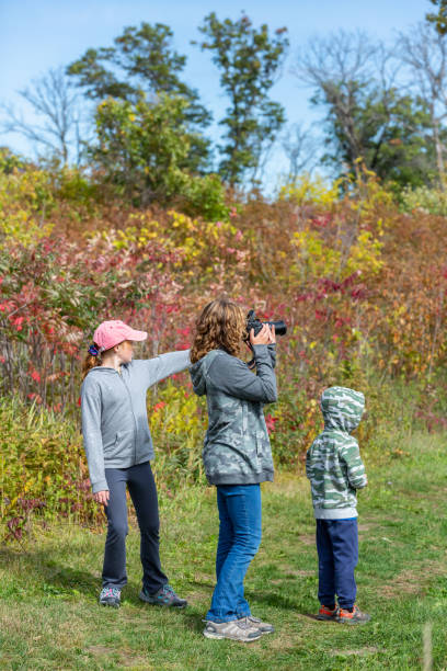 istock Girl Stopped to Take Photo During Hike 1344423544