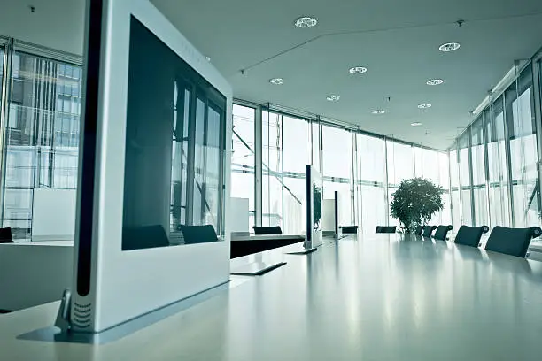 Meeting room with recessed screens