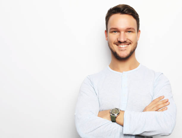 istock happy smiling man looking at camera on white background 1344432216