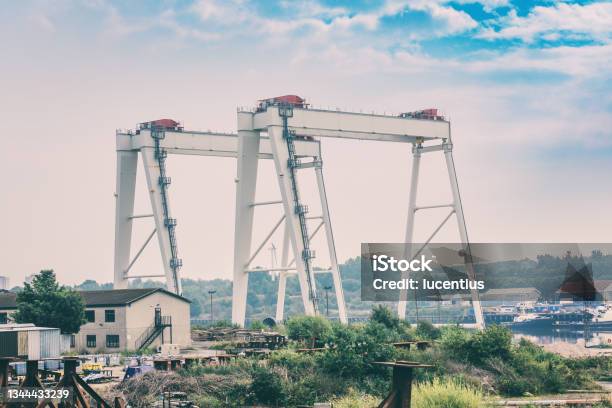 Two Gantry Cranes At Wallsend Uk Stock Photo - Download Image Now - Commercial Dock, Teesside - Northeast England, Newcastle-upon-Tyne