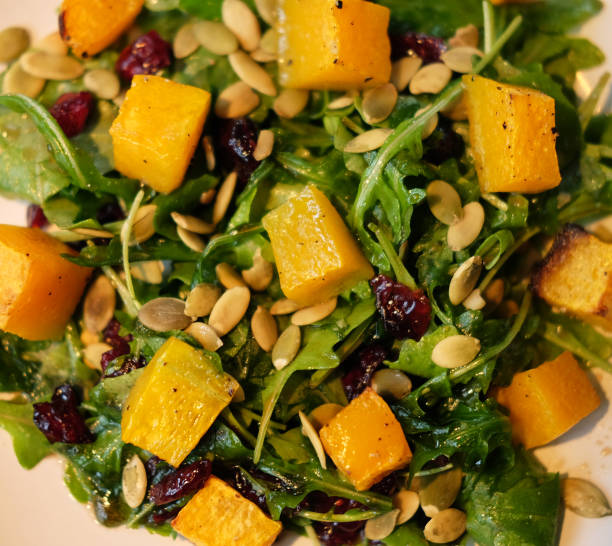 istock salad with pumpkin, pumpkin seeds and arugula 1344433418