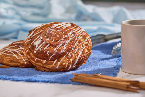 istock Close up of cinnamon rolls served on a marble table. Do it yourself concept. 1344433600