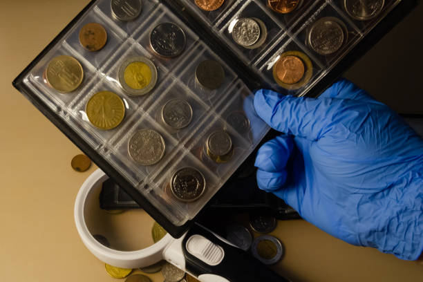 istock working with a collection of coins on the table magnifying glass 1344433654