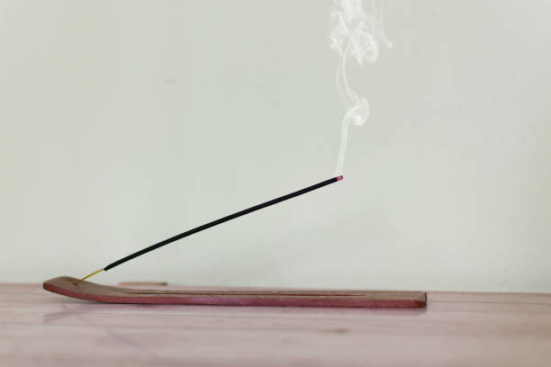 Aromatherapy, meditation - concept. Scented stick from which smoke comes out. incense photos stock pictures, royalty-free photos & images
