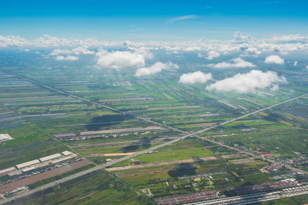 istock Aerial view from the top with clear cloud covered meadow and abundant rice fields on summer 1344434854