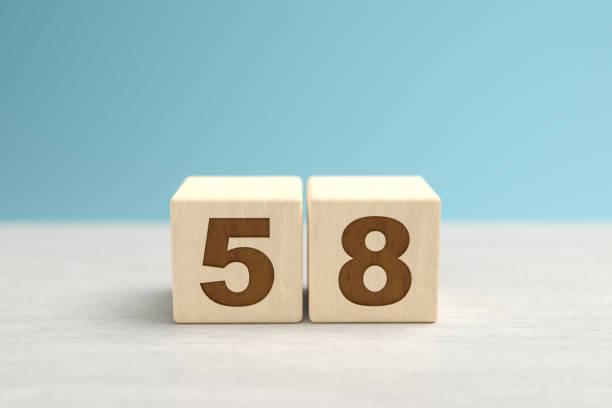 istock Wooden toy blocks forming the number 58. 1344438218