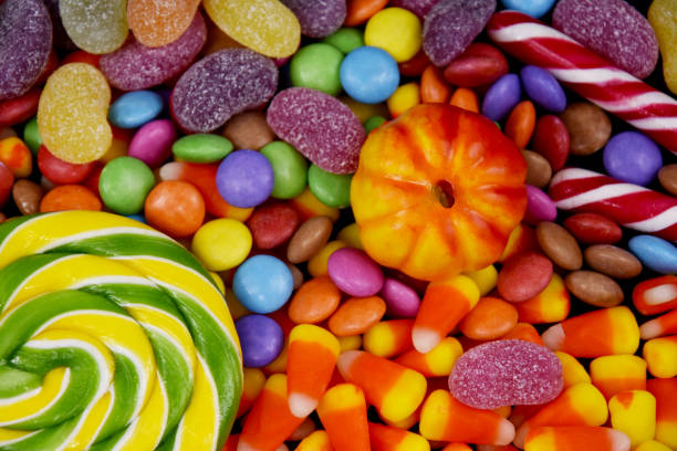 istock Mixed halloween candy background close-up top view stock images 1344438521