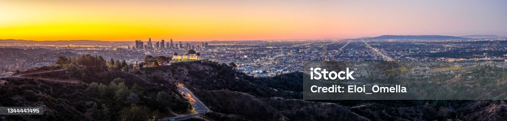 Los Angeles Skyline at Sunrise Panorama and Griffith Park Observatory in the Foreground. California. USA Los Angeles County Stock Photo