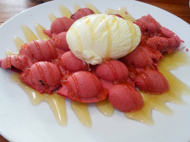 istock Red velvet egg waffle with vanilla ice cream 1344442050
