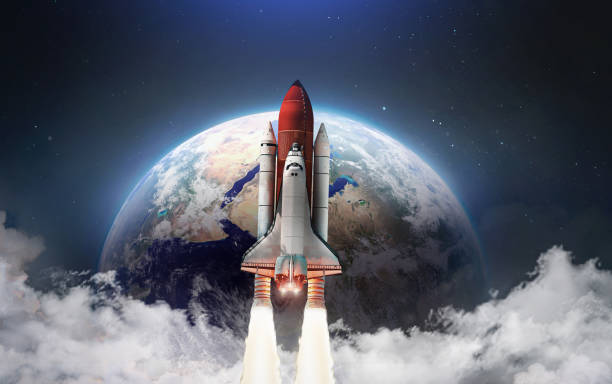 istock Spaceship in the outer space on orbit of Earth planet. Space shuttle in sky with clouds. Continents and oceans. Elements of this image furnished by NASA 1344443931