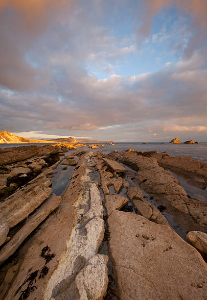 Sunset at Mupe Bay, Dorset, UK stock photo