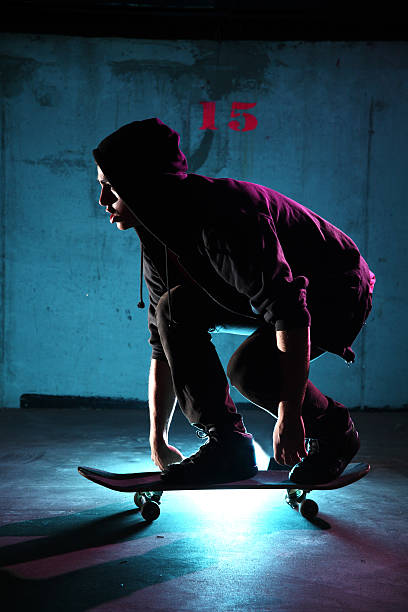 istock teenager skateboarding at night 134444674