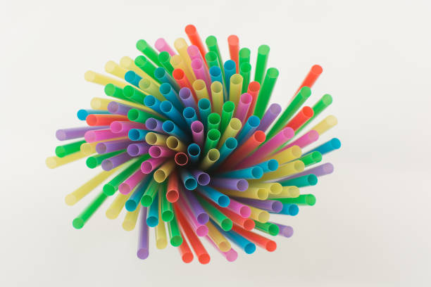 istock multicolored straws for drinks on a white background. Idea - party, decor, background, card for invitation. Horizontal photo, top view, soft focus, selective focus. 1344447856