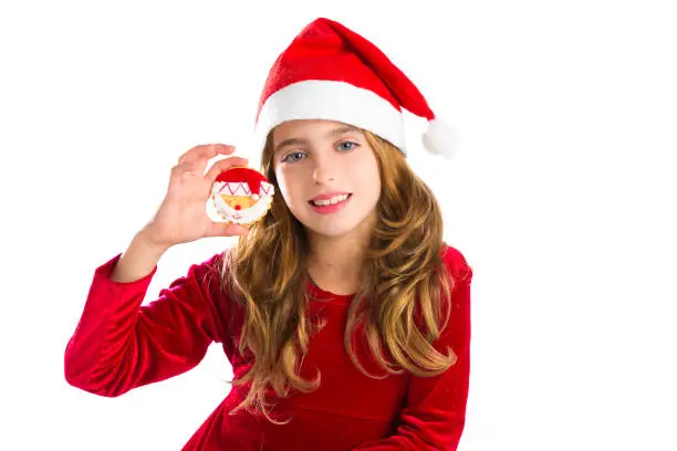 Christmas Santa cookie and Xmas dress kid girl isolated on white background