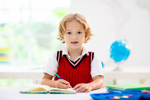 istock Kids in school. Children in class. 1344448909