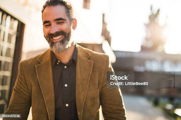 Modern Businessman Walking Stock Photo - Download Image Now - Men, Sun, Smiling