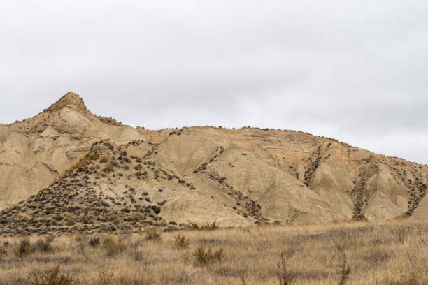 istock Empty desert landscape with open plateau and band of cliffs. 1344452319