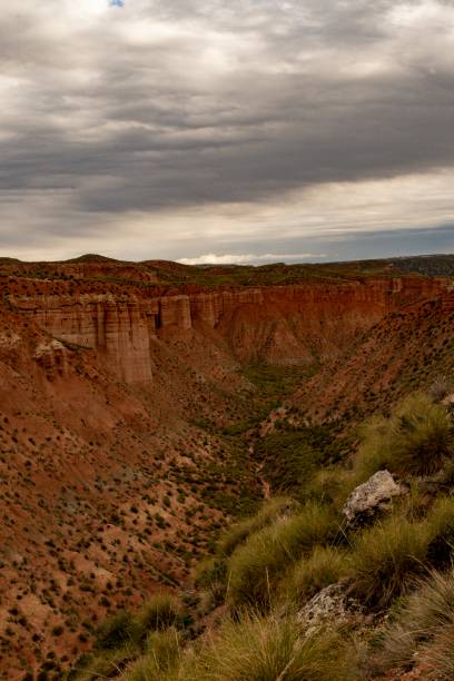 istock Empty desert landscape with open plateau and band of cliffs. 1344452364