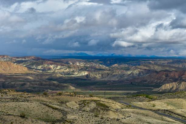 istock Empty desert landscape with open plateau and band of cliffs. 1344452374