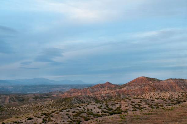 istock Empty desert landscape with open plateau and band of cliffs. 1344452400