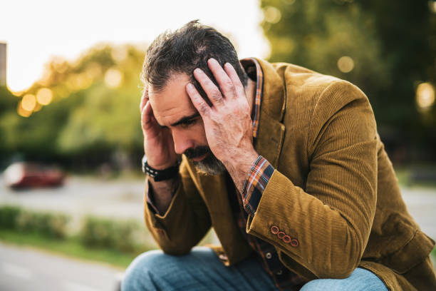istock Depressed businessman having headache 1344453494