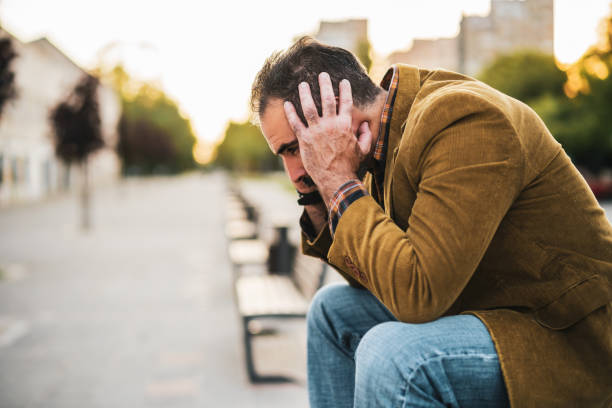 istock Depressed businessman having headache 1344453495