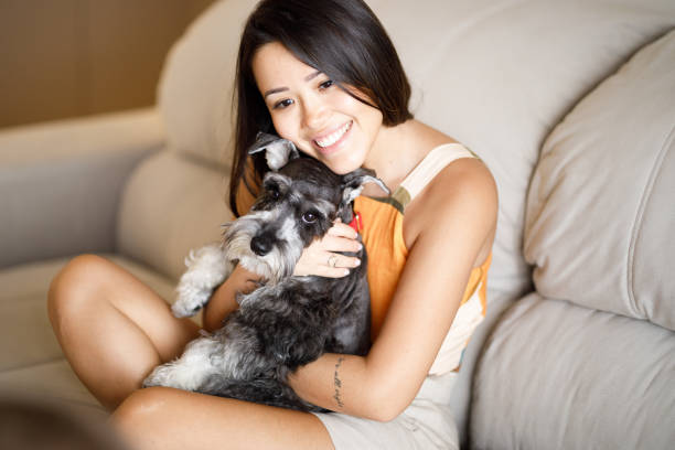 istock Beautiful woman embracing her dog 1344456982