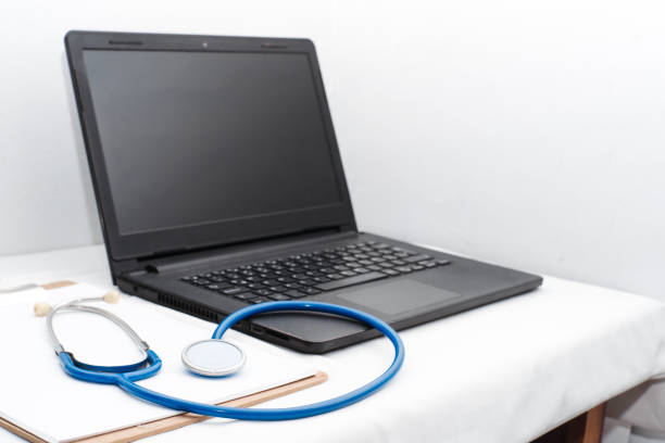 istock medical review chart next to a stethoscope next to a laptop with copy space. webinar concept of health and wellness and online medical consultation. 1344457438