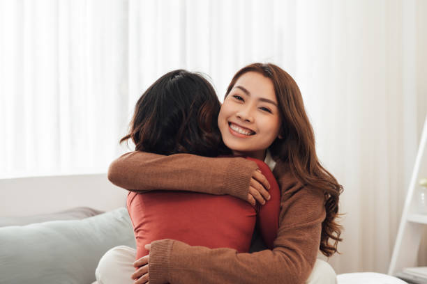 istock Young couple smiling happy and hugging sitting on the bed. 1344458176