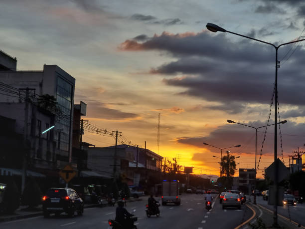 istock city traffic flow in the evening, orange sky 1344458261
