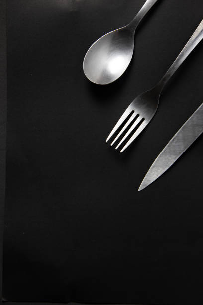 istock Cutlery Set of, Knife , Spoon and Fork on a dark background 1344458316