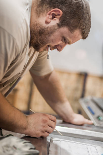istock Professional worker technician machinist work in factory production workplace 1344459137