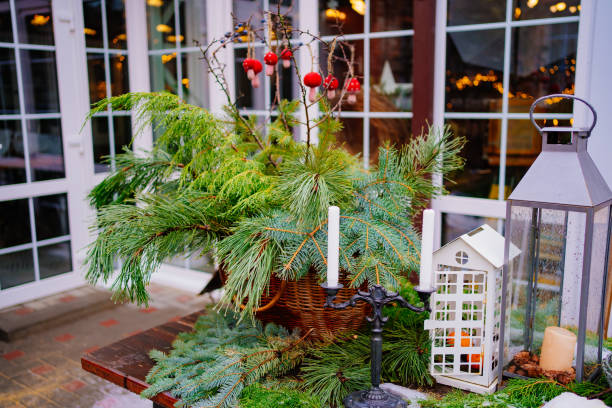 istock table decorated for new year with coniferous branches, lanterns and candles. 1344459152