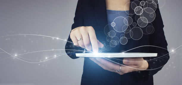 istock Innovation, big data concept technology. White tablet in businesswoman hand with digital hologram circular diagram icon sign on grey background. 1344459192