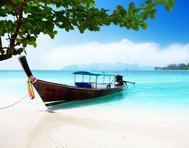 istock long boat and poda island in Thailand 134445970