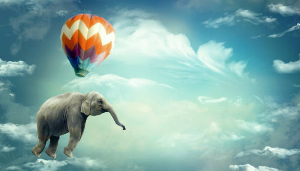Huge Elephant floating or flying with air balloon with sky and clouds background. Fantastic surreal fantasy illustration. Freedom concept.Imagination.Surrealism. Dream. Banner copy space Surreal illustration that expresses lightness, freedom and potential. Possible use to express the concept of the possibility of making a dream come true. Travel concept. Daydreaming. Possible use in the circus environment surreal stock illustrations