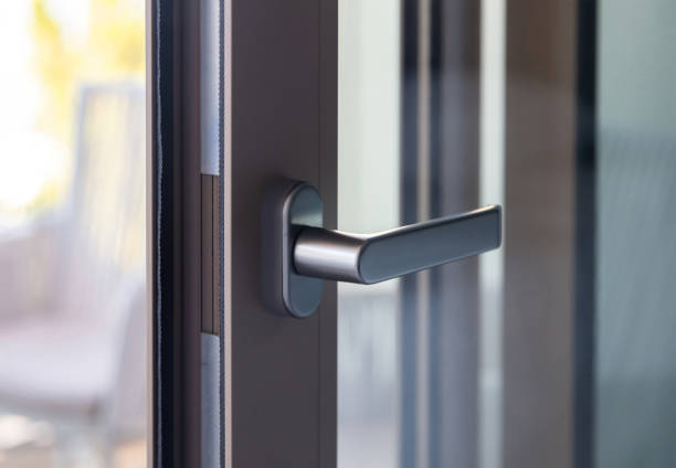 istock Aluminum door window close up, open glass frame with black handle, blur background 1344462505