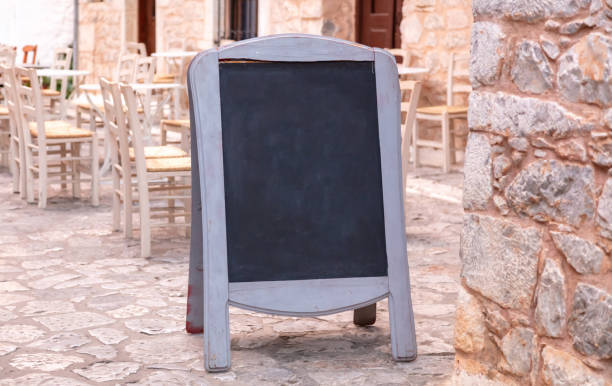 istock Menu board. Chalkboard blank with wooden frame outdoors on a sidewalk. Today menu template, 1344462535