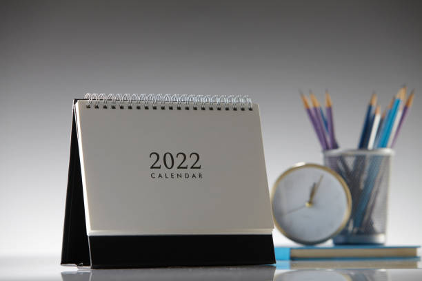 istock 2022 desktop calendar and alarm clock 1344462651