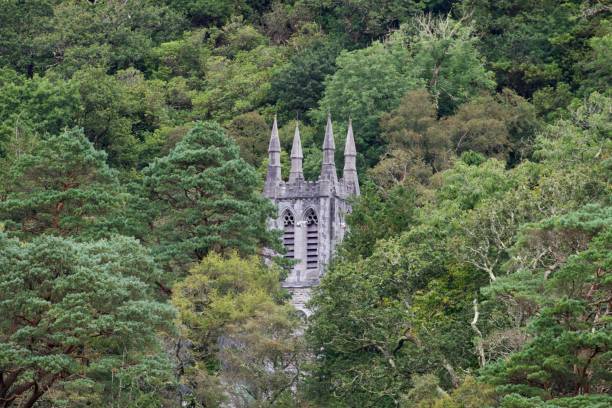 Kylemore Abbey chapel inside the forest, Connemara, Ireland Kylemore Abbey chapel inside the forest, Connemara, Ireland kylemore abbey stock pictures, royalty-free photos & images