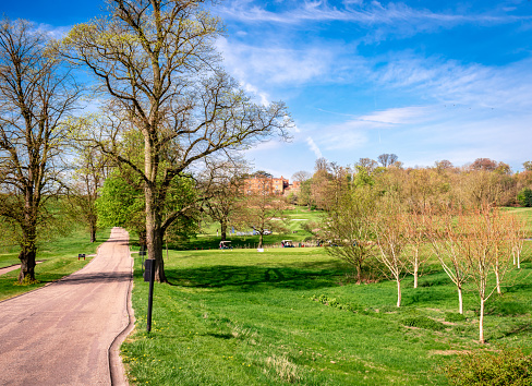 Scenic country landscape, next to the River Gade and the Grand Union Canal, in Cassiobury Park. Chandlers Cross, Watford, Hertfordshire, UK. The luxurious hotel The Grove can be hardly seen in the background