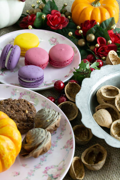 istock macarons, cookies, coffee, colorful accessories on the table 1344466662