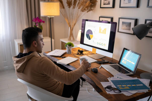 istock Young man working at home in the evening 1344469353