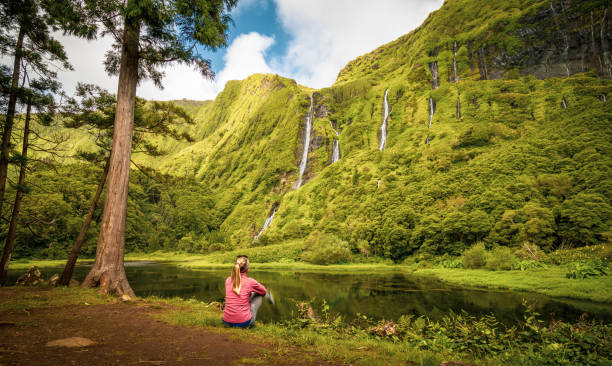 amazing waterfalls, lake with reflection, water, green landscape, azores islands. - number of people human gender people waterfall imagens e fotografias de stock