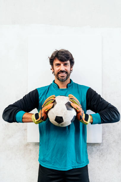 portrait of a male goalie with soccer ball - soccer glove imagens e fotografias de stock