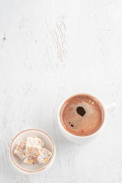istock Cup of coffee and Turkish delight on wooden table 1344473518